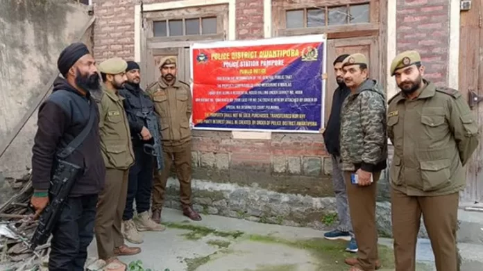 Police Attach House and Land of Separatist in Pampore