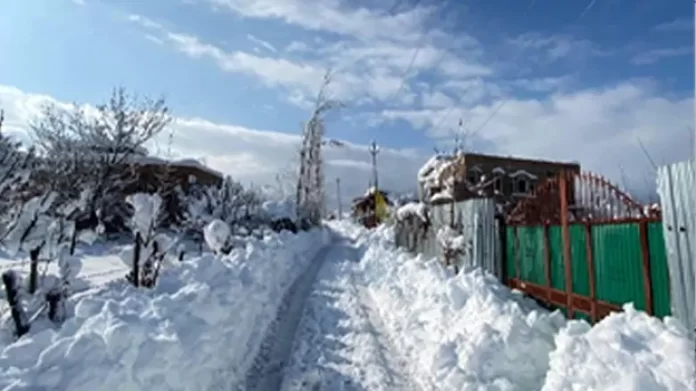 Snow-covered damaged house in Uri Kashmir; Blocked roads in Boniyar after heavy snowfall.